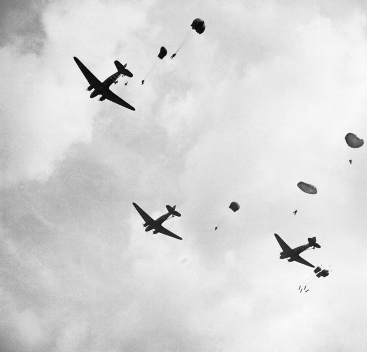 Paratroopers drop from Dakota aircraft over the outskirts of Arnhem 